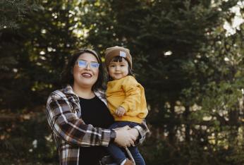 Mother holding daughter