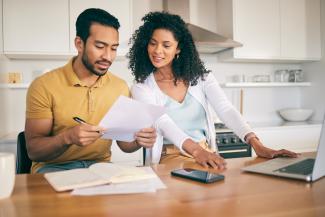 Couple looking at bills