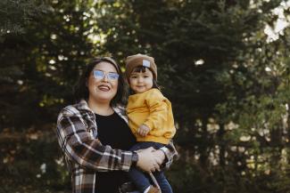 Mother holding daughter